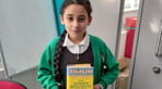 Forest Fields Primary and Nursery School - student holding a book.jpg
