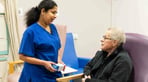 Nurse-talking-with-patient-in-discharge-lounge-aspect-ratio-16-9.jpg