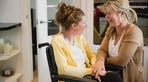 Young adult in wheelchair with carer.jpg