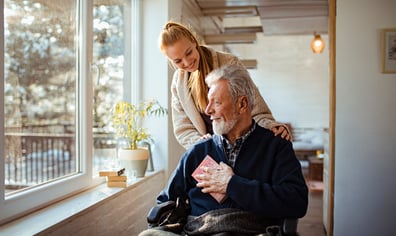 Carer and male in wheelchair