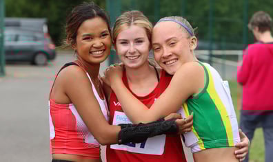 Athletics girls together hugging_credit Activity Alliance