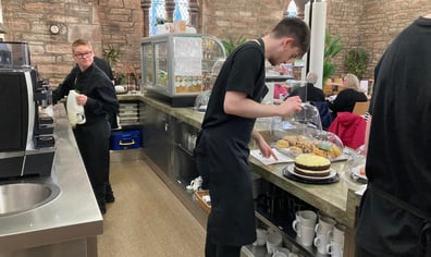 Behind the counter Ryan and Harry