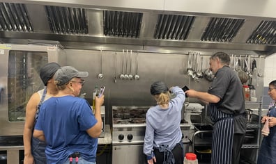 Ella pouring water into pot