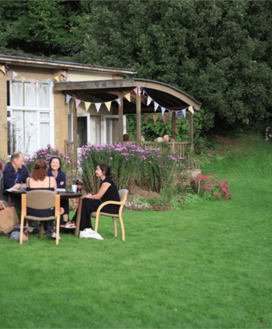 bwt_group_outside_hawkwood_with_bunting_background_2018_12_05_04_04_27_pm
