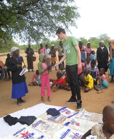 Gabor_helping_with_distribution_of_pre_school_material